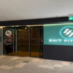 247 Fitness gym storefront fit-out by Trident Fitout, glass entrance beneath backlit signage