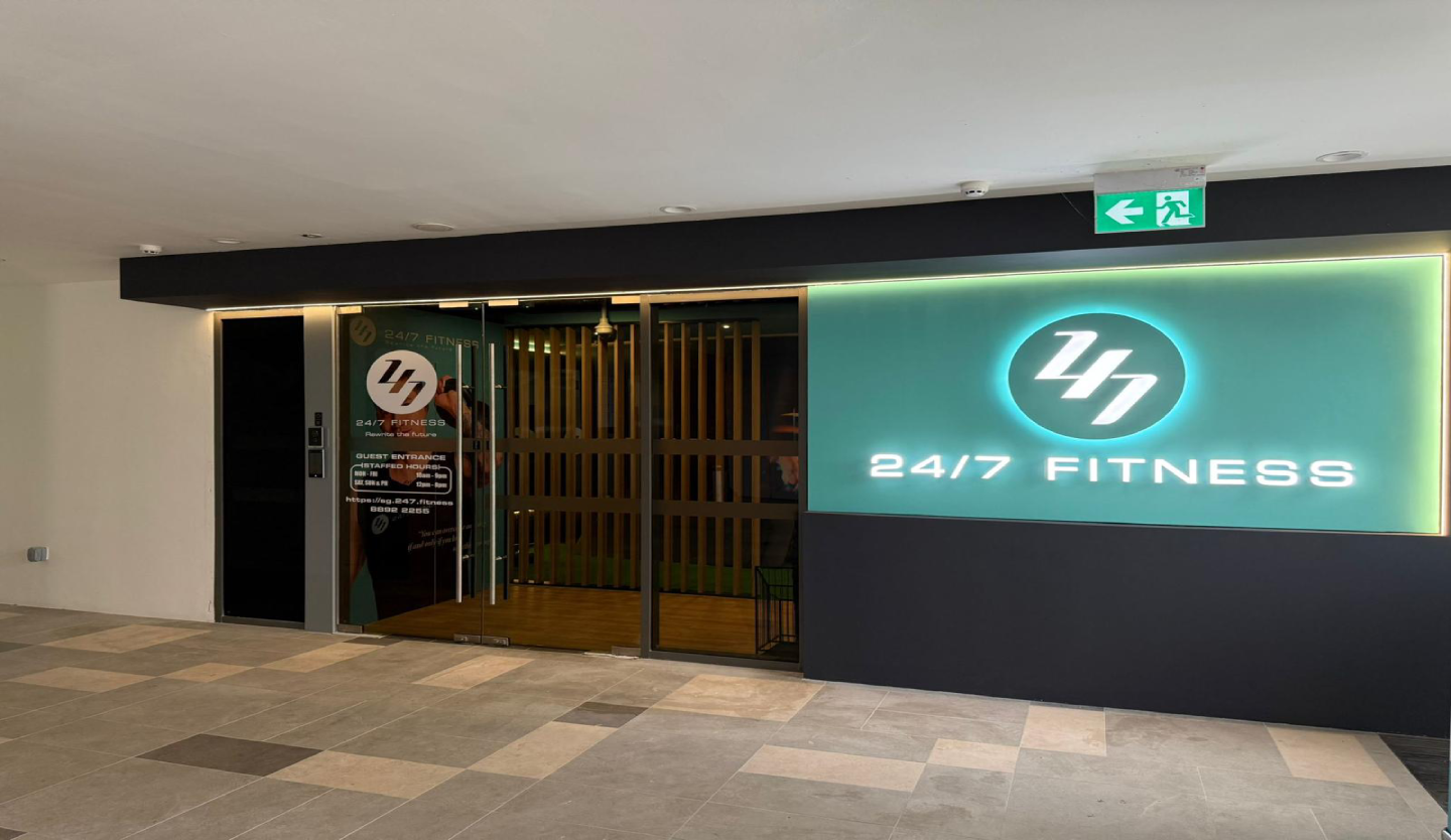 247 Fitness gym storefront fit-out by Trident Fitout, glass entrance beneath backlit signage