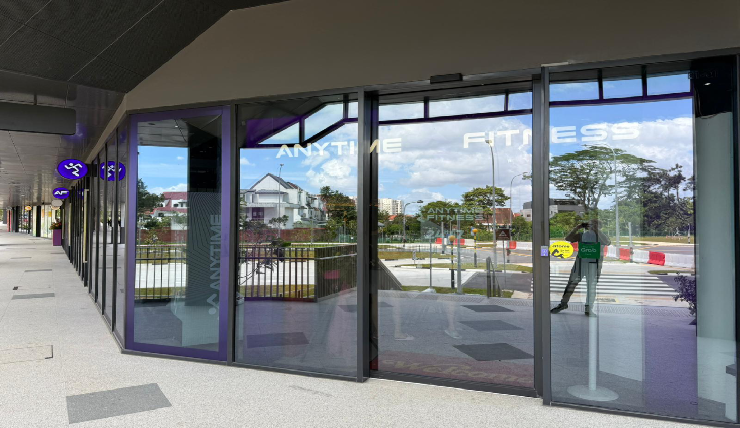 Anytime Fitness gym storefront fit-out by Trident Fitout, glass shopfront along a covered walkway facing a residential estate