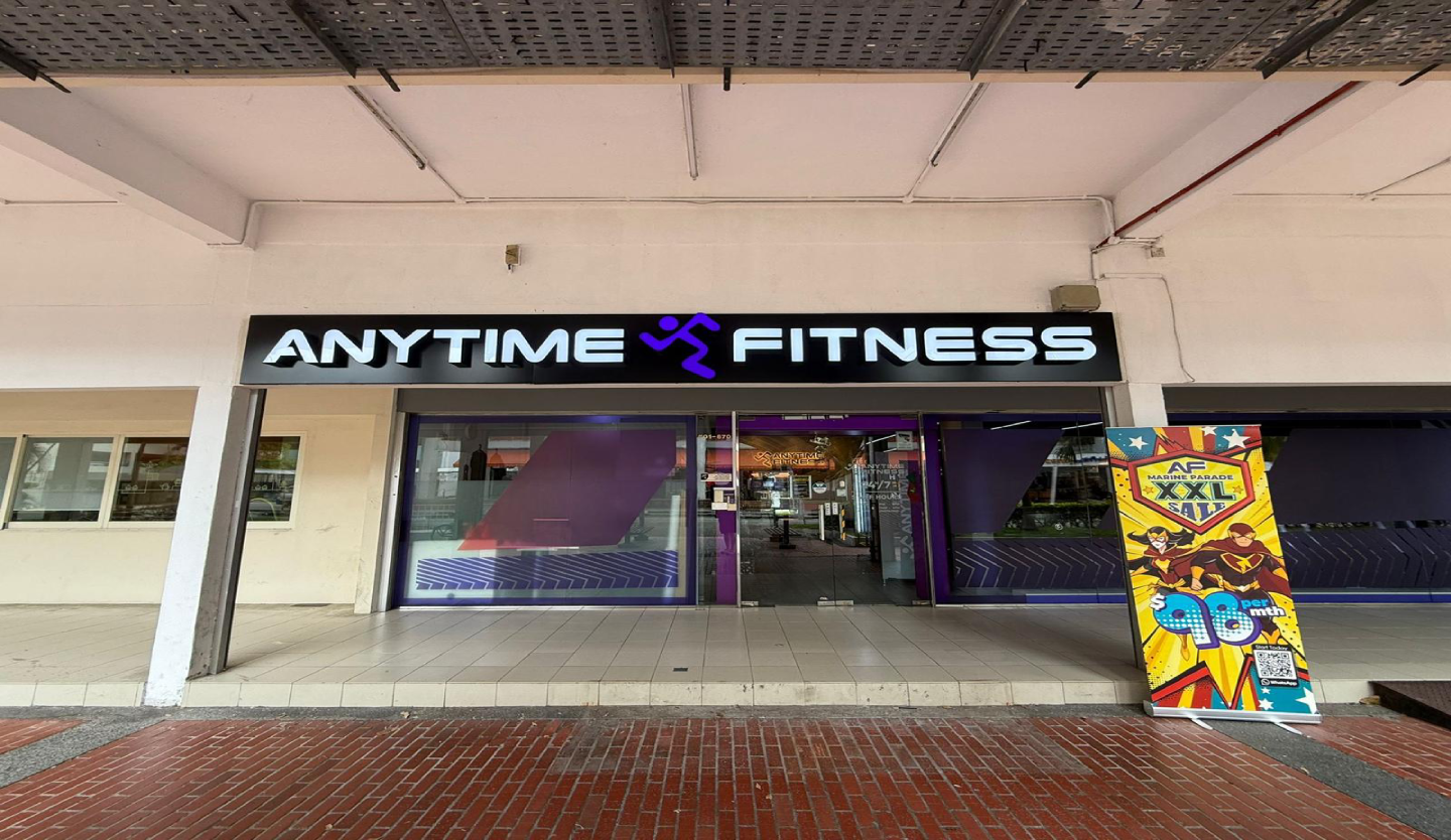 Anytime Fitness gym storefront fit-out by Trident Fitout, shopfront signage along a covered walkway with a promotional banner stand