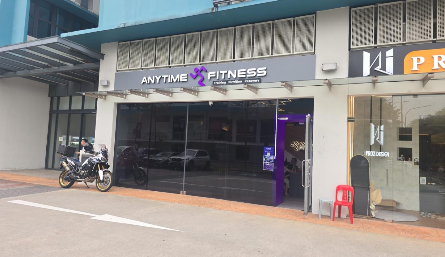 Anytime Fitness gym storefront fit-out by Trident Fitout, ground floor unit beside a motorcycle parking bay