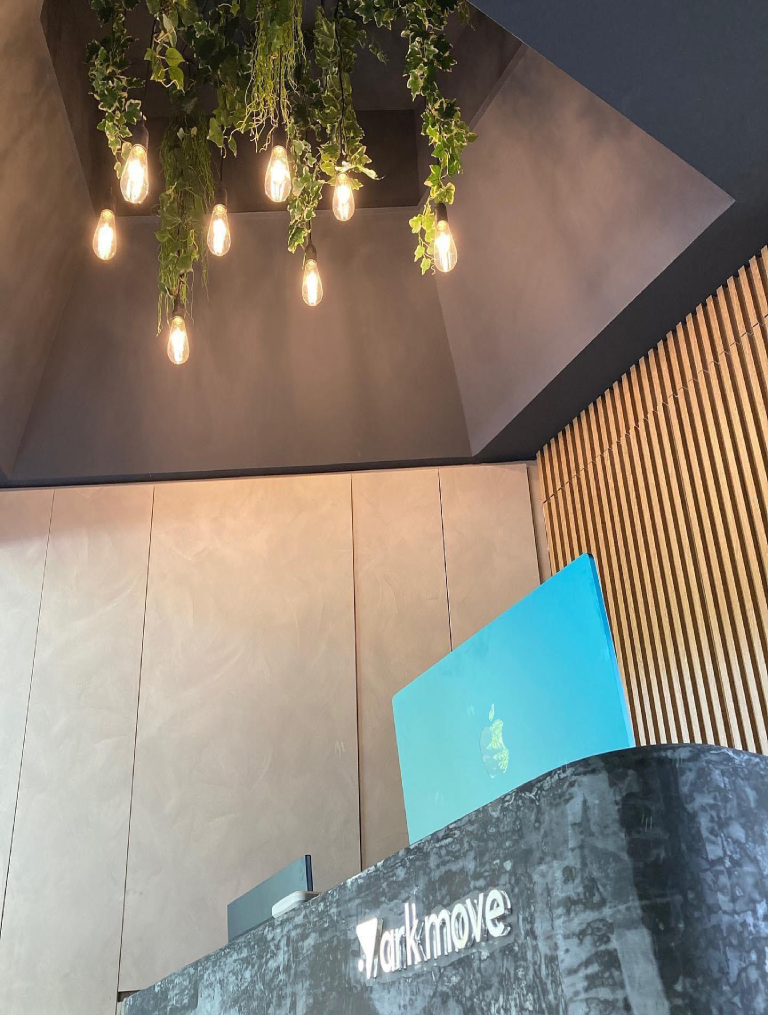 ark liv changing room fit-out by Trident Fitout, timber lockers beneath a round mirrored ceiling feature