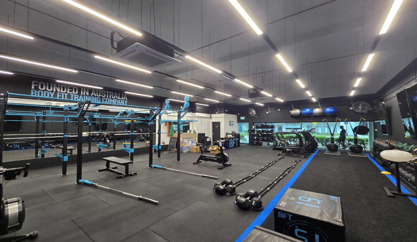 Body Fit Training gym fit-out by Trident Fitout, training floor equipment beneath a Founded In Australia mirror wall