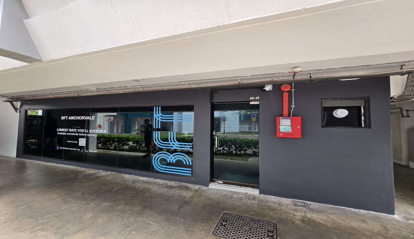 BFT Anchorvale gym storefront fit-out by Trident Fitout, dark shopfront with pre-opening rate signage at unit #01-09