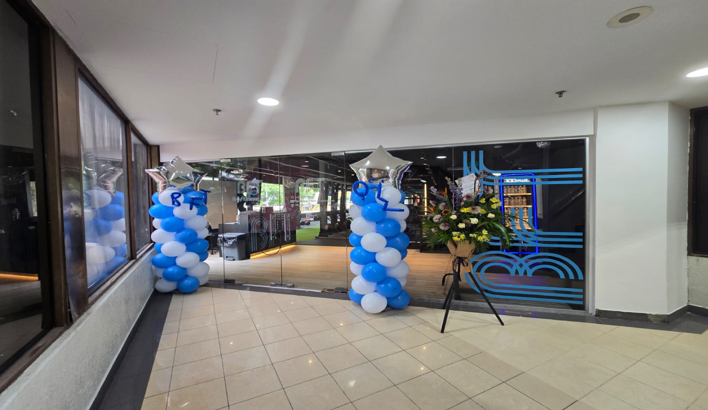 Body Fit Training gym storefront fit-out by Trident Fitout, entrance decorated with balloon columns and flowers for its opening