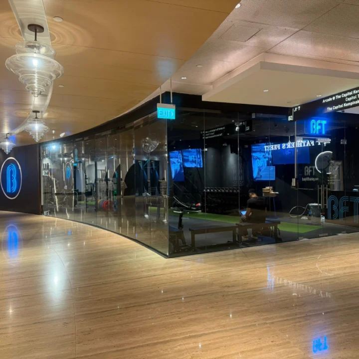 BFT gym storefront with glass frontage and illuminated signage, fitout by Trident Fitout.