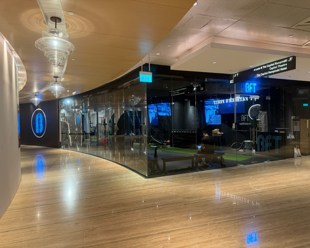 BFT gym storefront with glass frontage and illuminated signage, fitout by Trident Fitout.