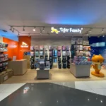 Tiger Family retail store fit-out by Trident Fitout, schoolbag display shelving beside the tiger mascot figure