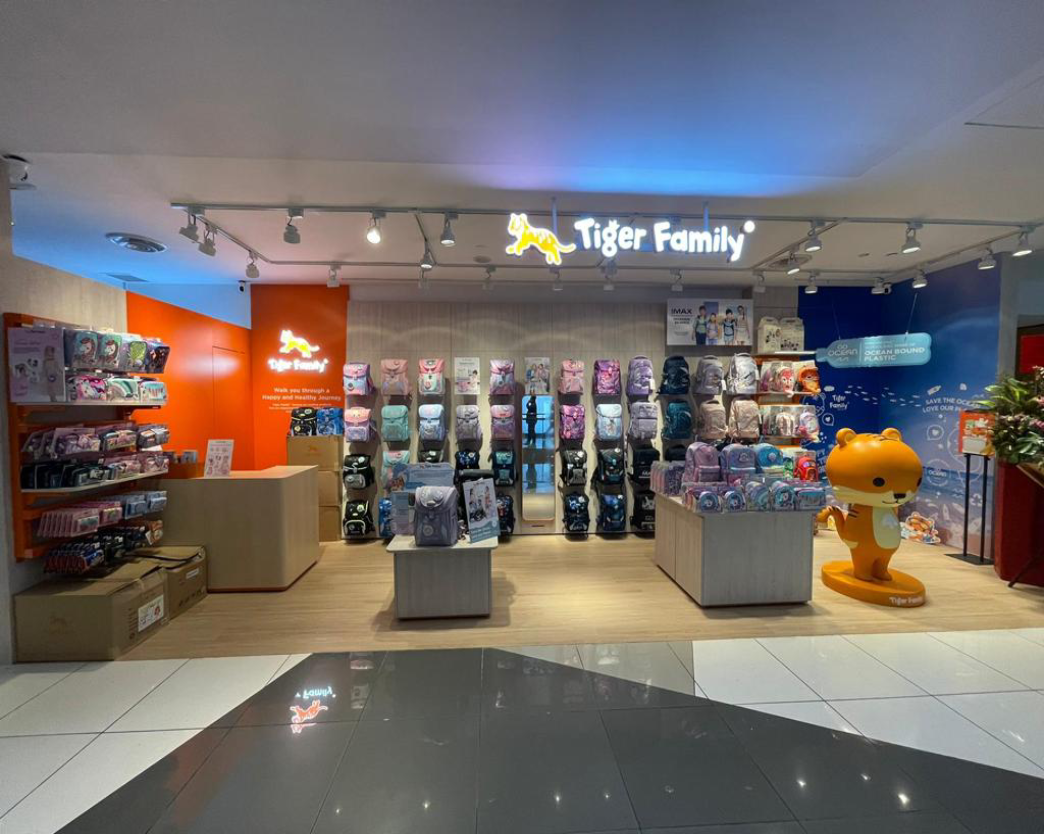 Tiger Family retail store fit-out by Trident Fitout, schoolbag display shelving beside the tiger mascot figure